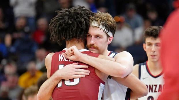 Gonzaga Bulldogs forward Drew Timme (2) hugs Arkansas Razorbacks forward Jaylin Williams (10) after the game in the semifinals of the West regional of the men's college basketball NCAA Tournament at Chase Center. The Arkansas Razorbacks won 74-68.